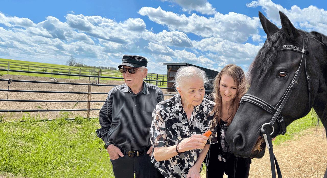 Lisa Levasseur and her family at the Excella Equine Park barn – Lisa founded Alberta's premier equestrian acreage community.
